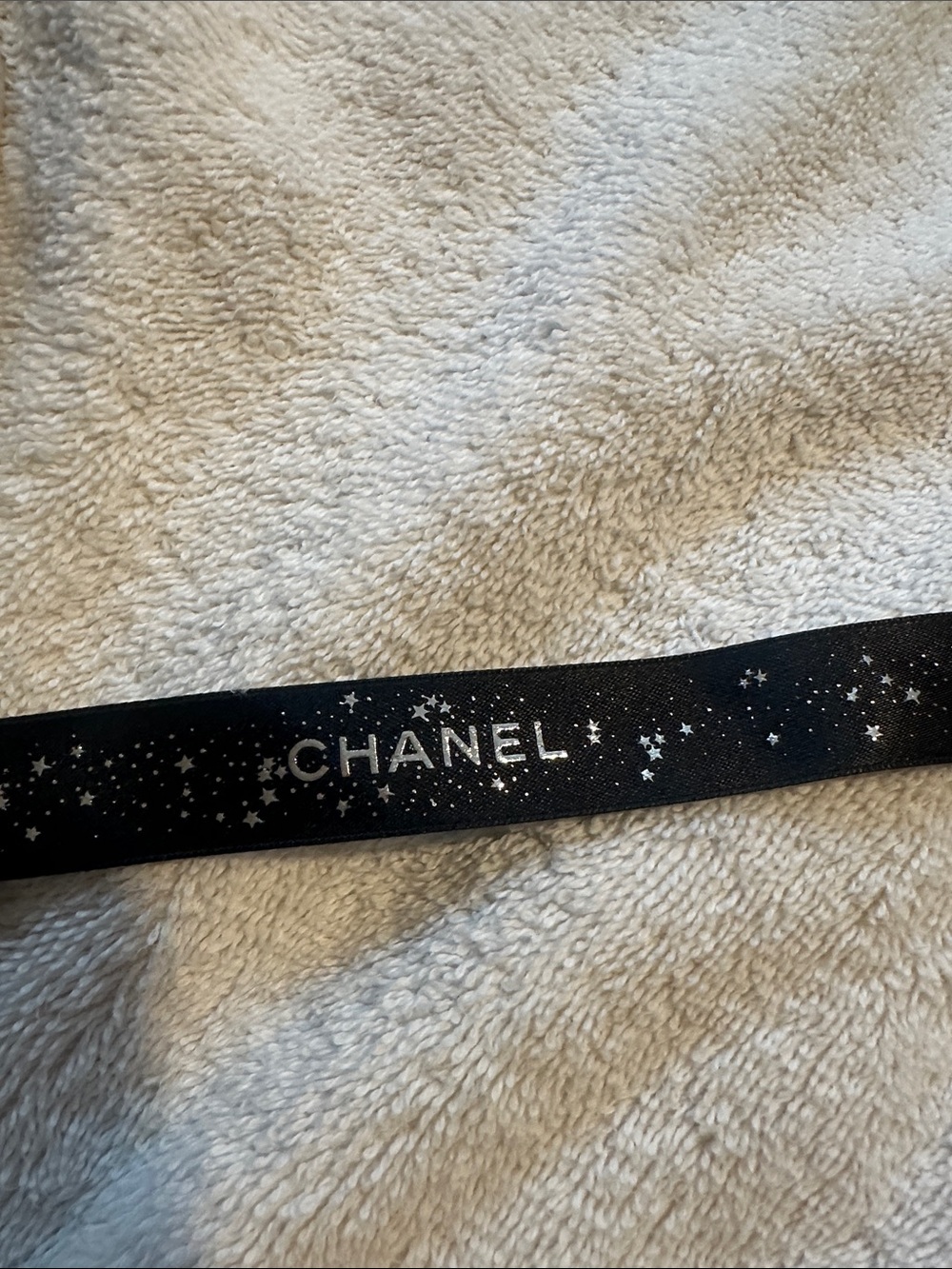 CHANEL Black Ribbon with Silver Star Motif